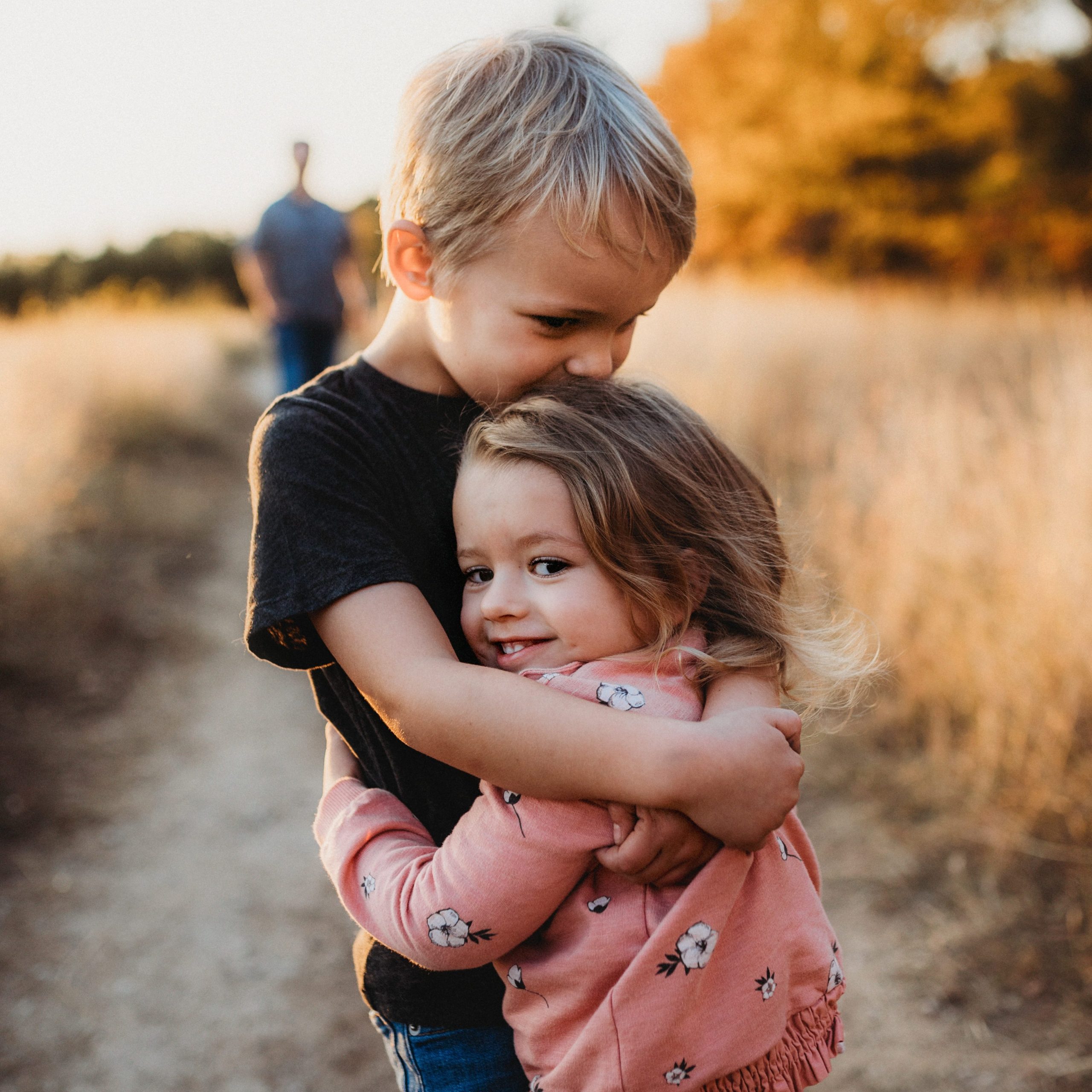 Kids hugging at our kid camp