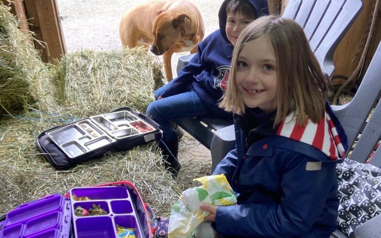 kids camp enjoying a picnic